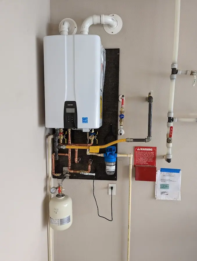 Professional plumber installing copper piping in a Middleburg home